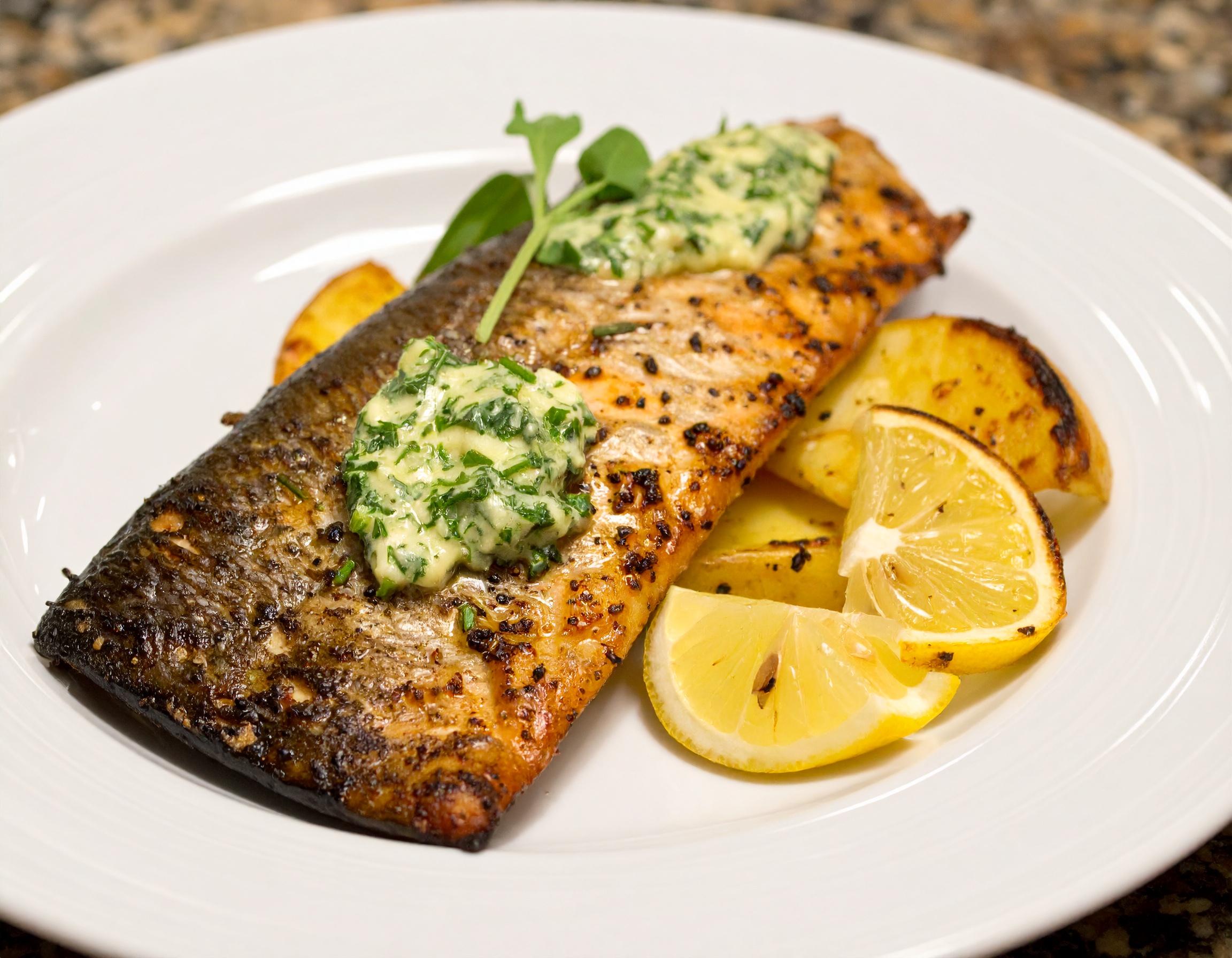 Grilled Steelhead with Garlic, Rosemary, and Thyme Butter